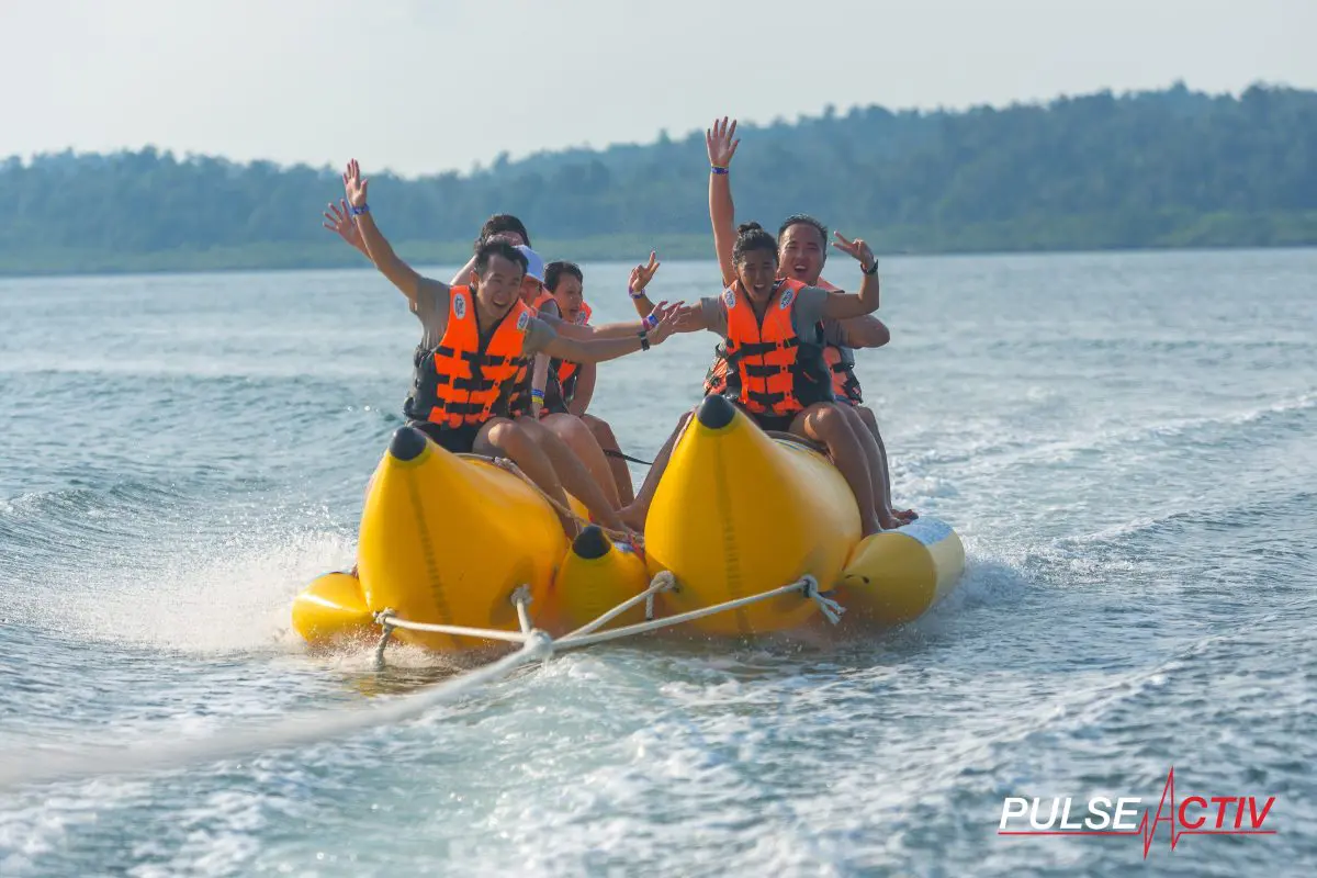 Team Building Events Gallery - Group Photo Overseas Retreat Outdoor Water Sports Banana Boat