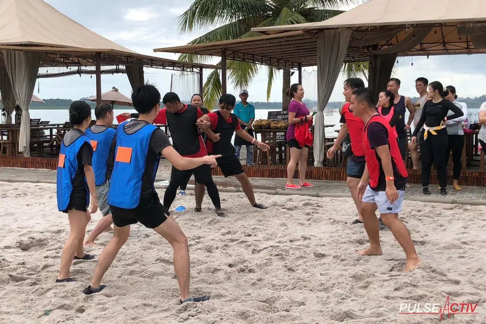 Team Building Events Gallery - Group Photo Overseas Retreat Beach Outdoor Bonding Running Man