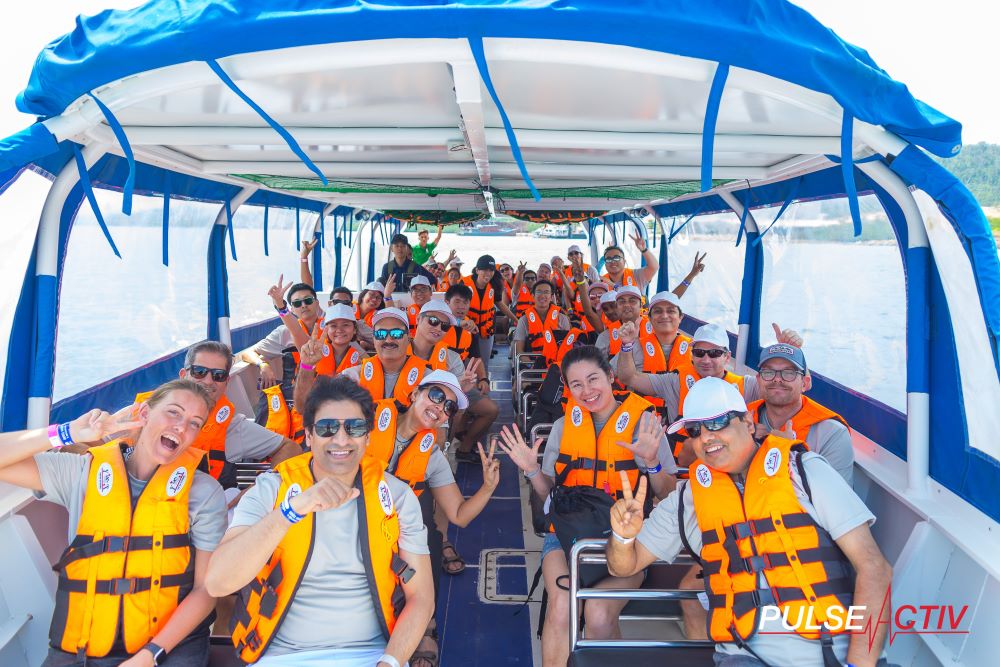 Team Building Events Gallery - Group Photo Overseas Retreat Boat